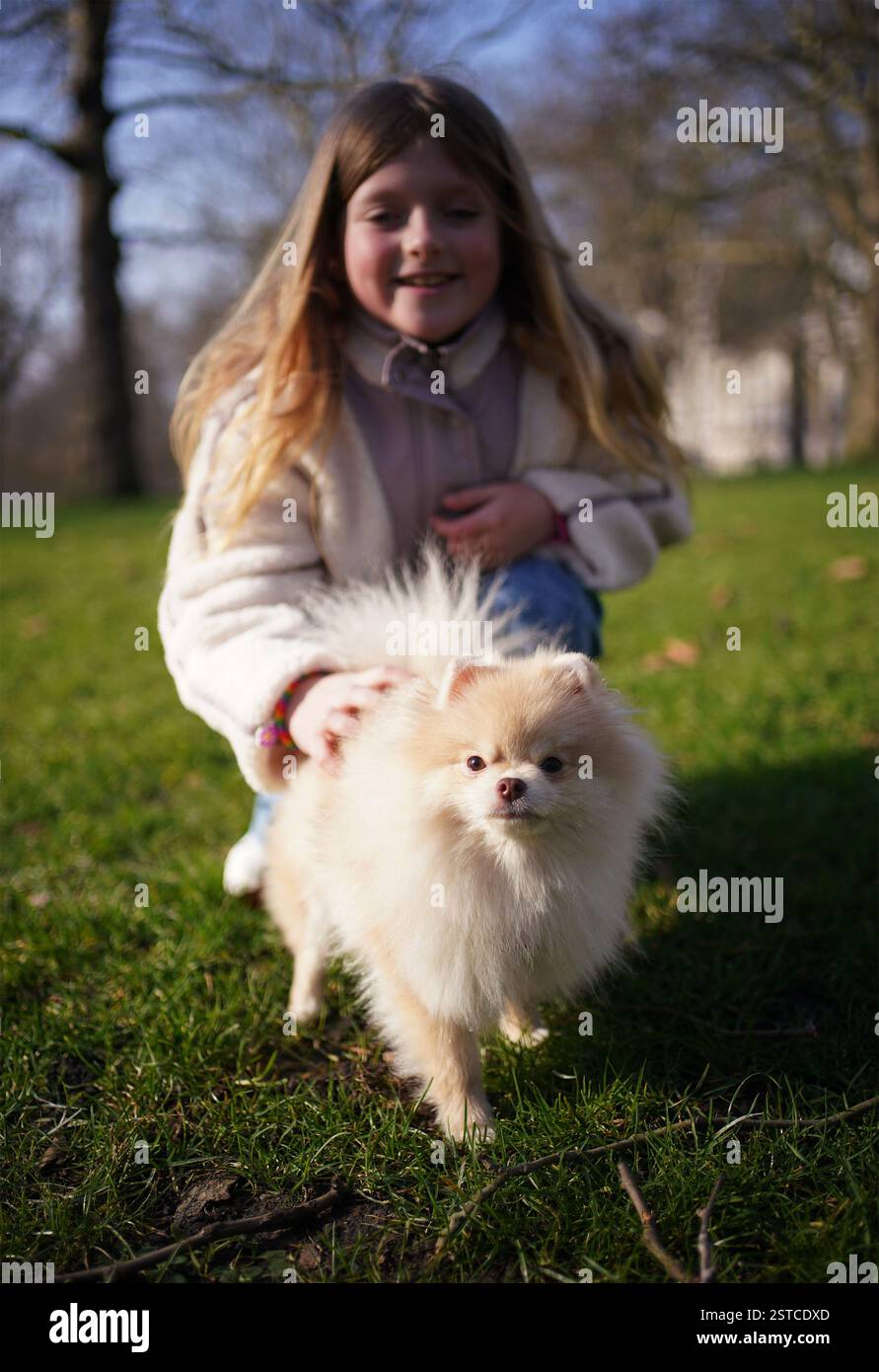 Rozalyn Merrett, 9, from Nottinghamshire, with Rosa, an 11monthold Pomeranian, during a launch