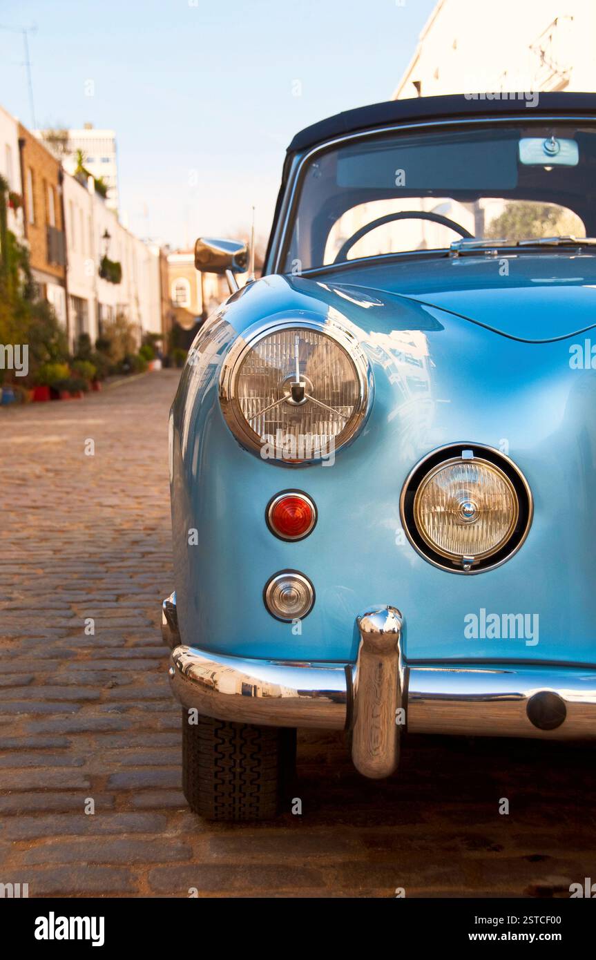 Blue vintage car parked in a paved street hi-res stock photography and ...