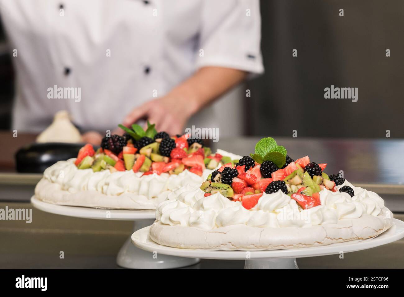 woman preparing cakes in kitchen Stock Photo