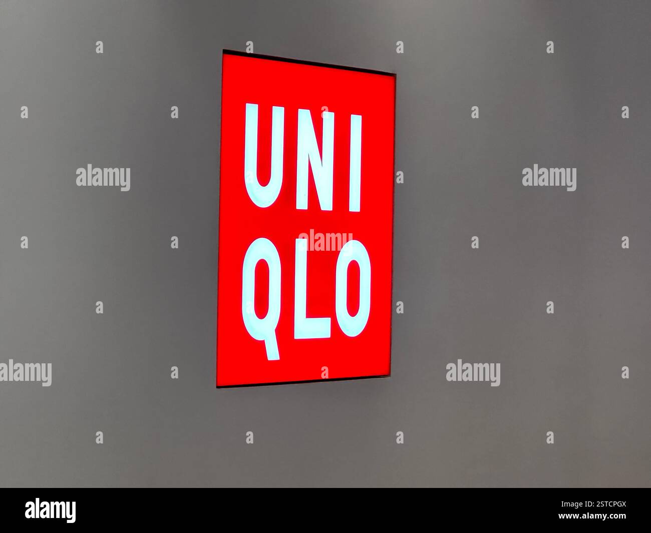 Guangzhou, China, Jan 27, 2024. Uniqlo clothing store logo. Uniclo is a Japanese casual wear designer, manufacturer and retailer. - Smartphone Captured Stock Image