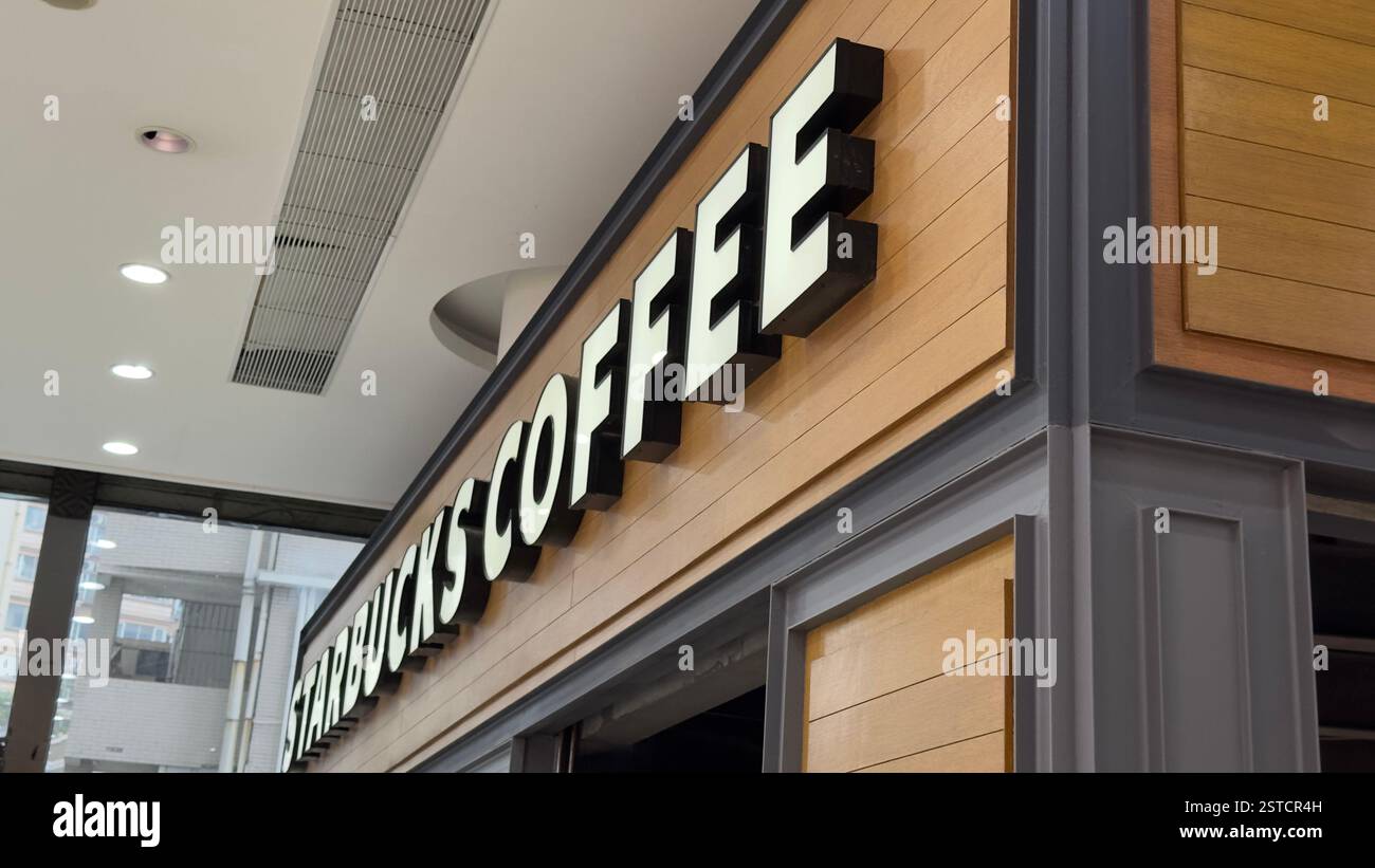 Guangzhou, China - Jan 27, 2024: Starbucks coffee shop. Starbucks Coffee is an American chain of coffee shops founded in Seattle - Smartphone Captured Stock Image