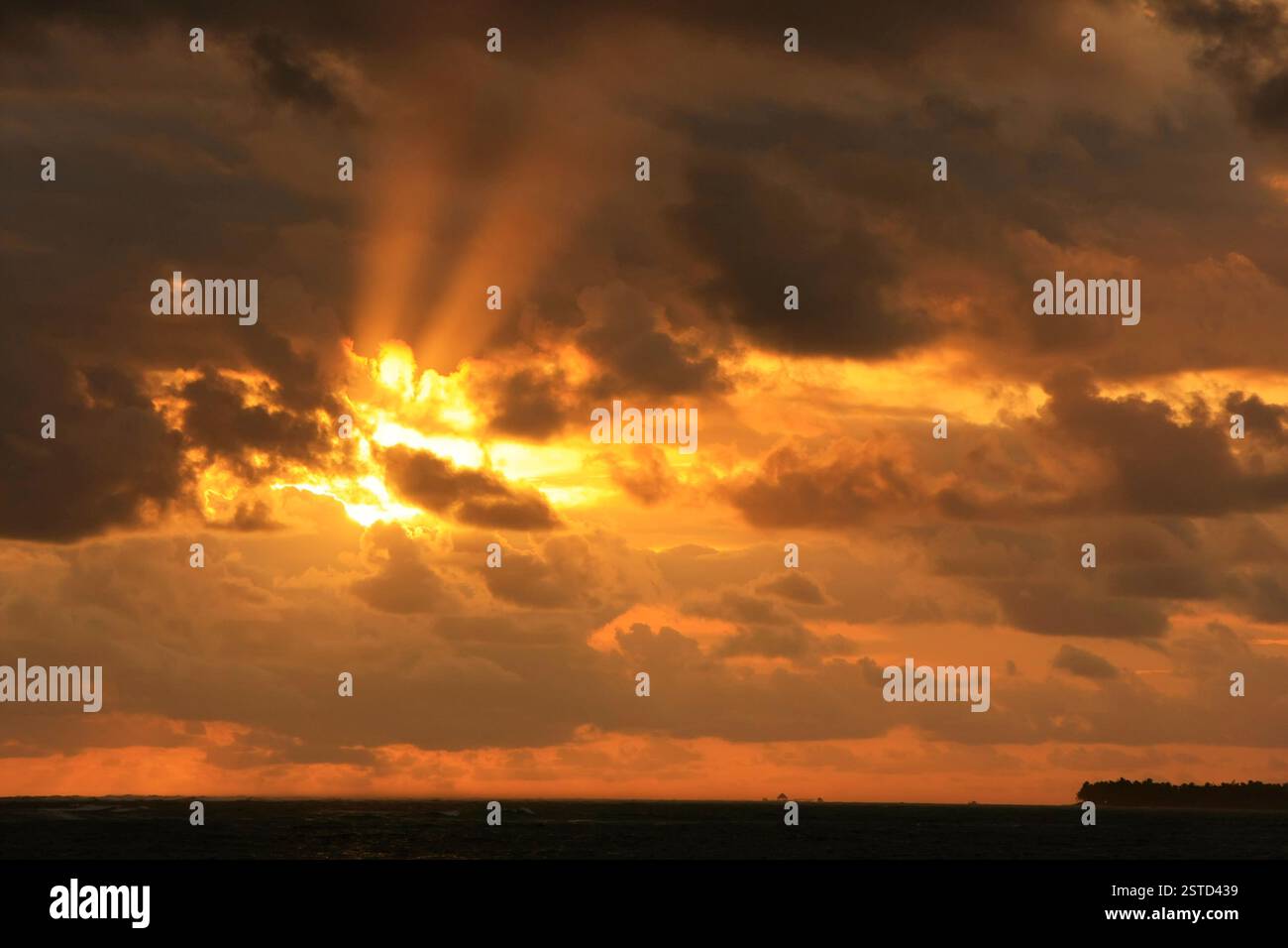 Sun rays through storm clouds hi-res stock photography and images - Alamy