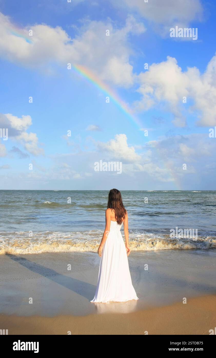 Young woman in white dress on a beach Stock Photo - Alamy