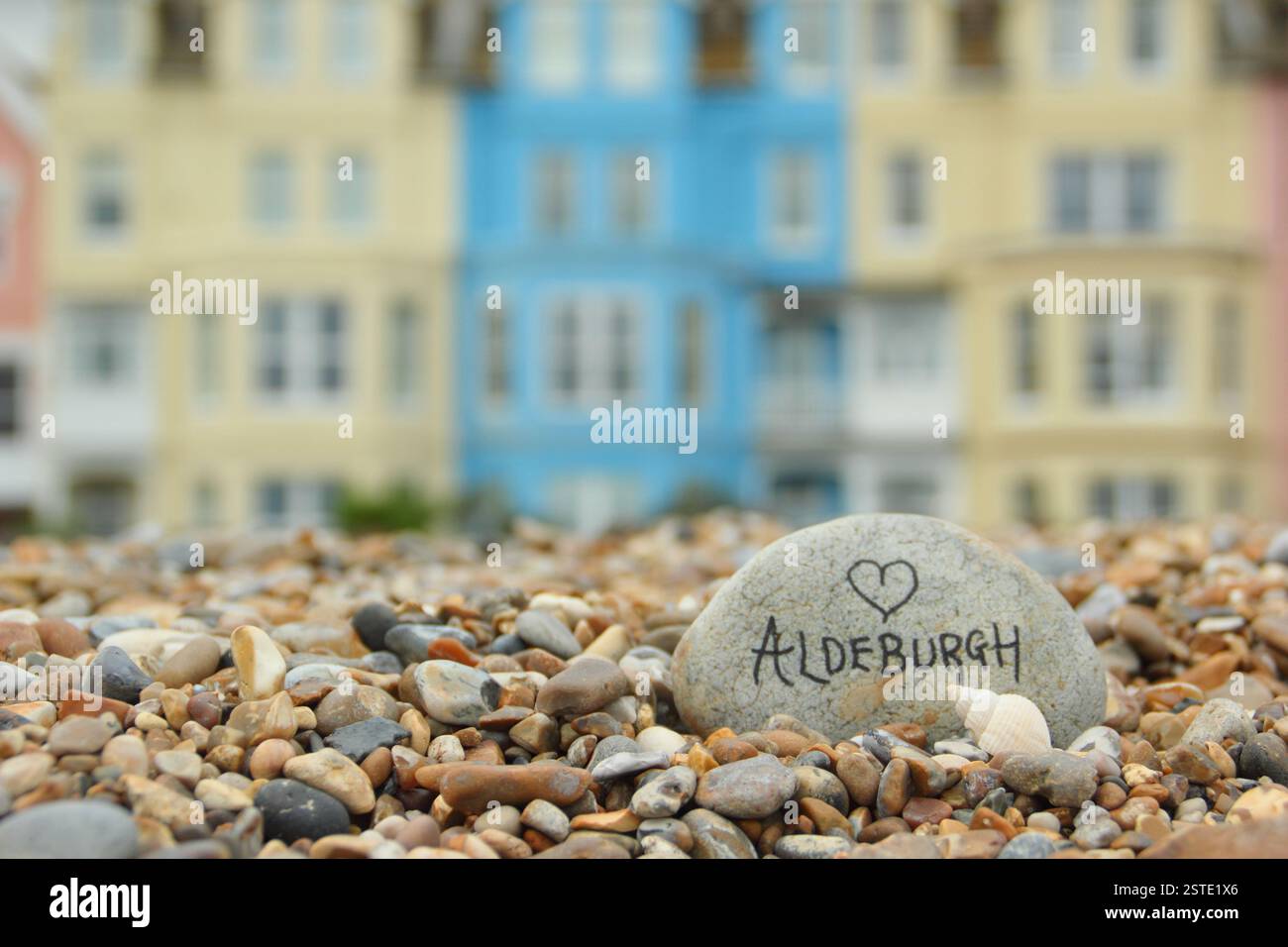Aldeburgh, Suffolk. Pastel coloured villas by the pebble beach at Aldeburgh, a pretty English seaside town in the East of England, Suffolk, UK Stock Photo