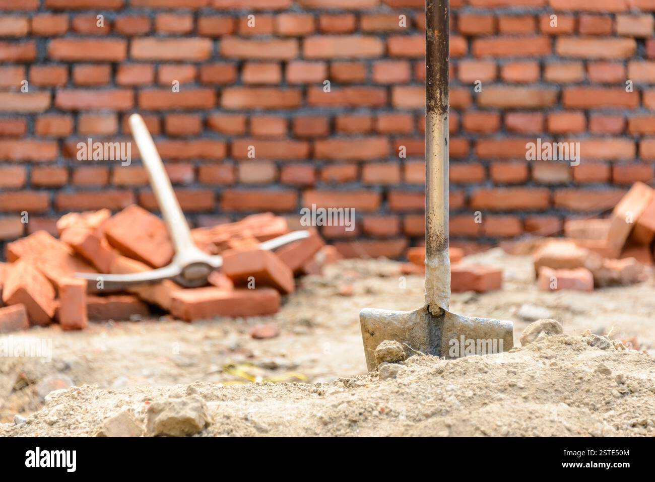 Shovel and pickaxe on a construction site Stock Photo