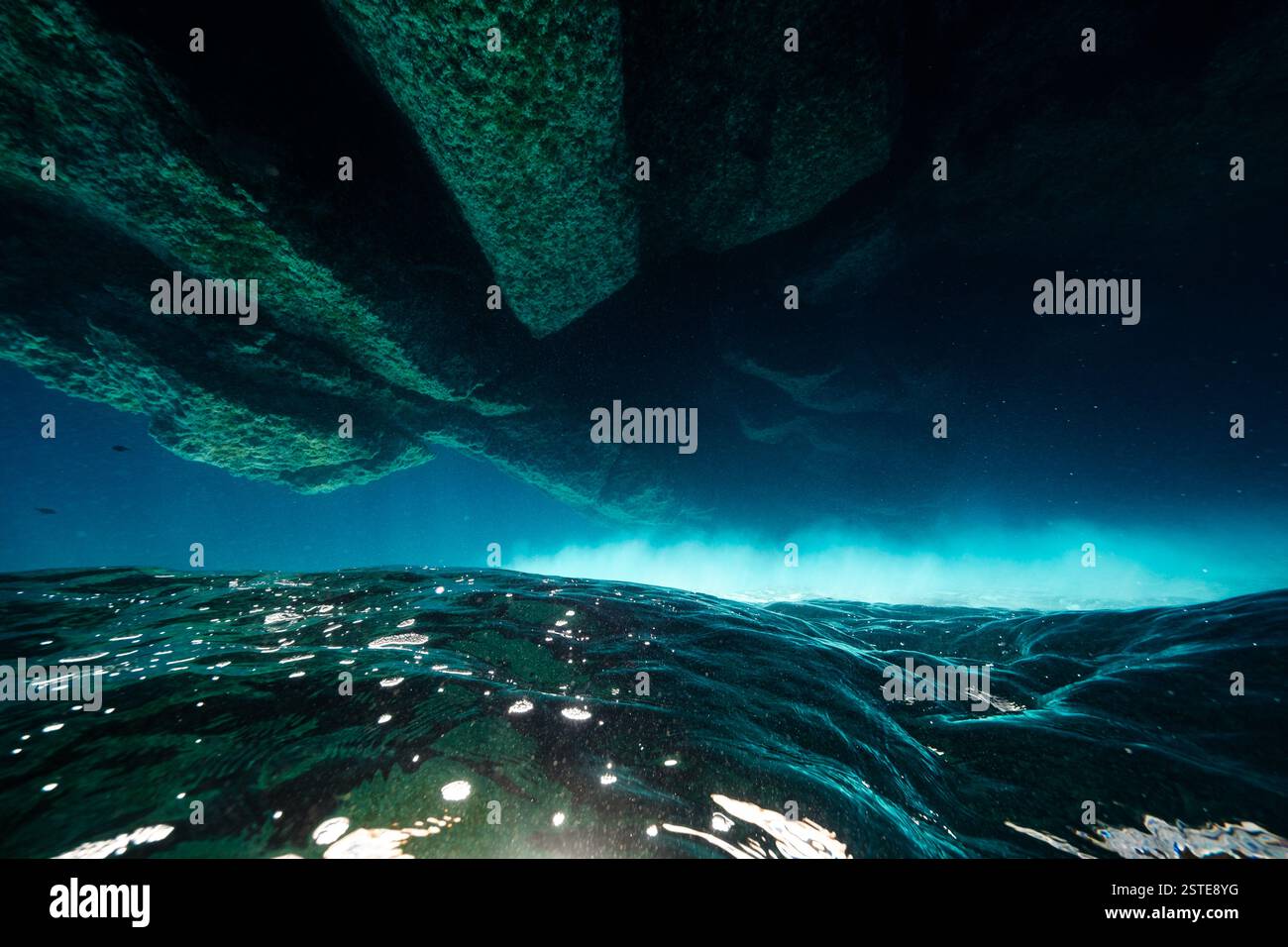 Underwater view of majestic rough rock formations in bottom of ...