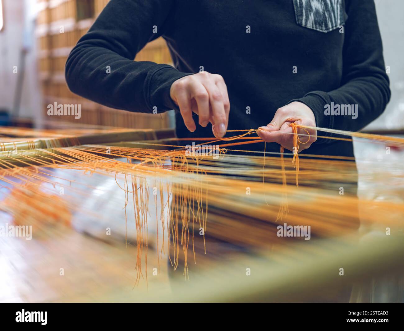 Close up weaving process in hi-res stock photography and images - Alamy