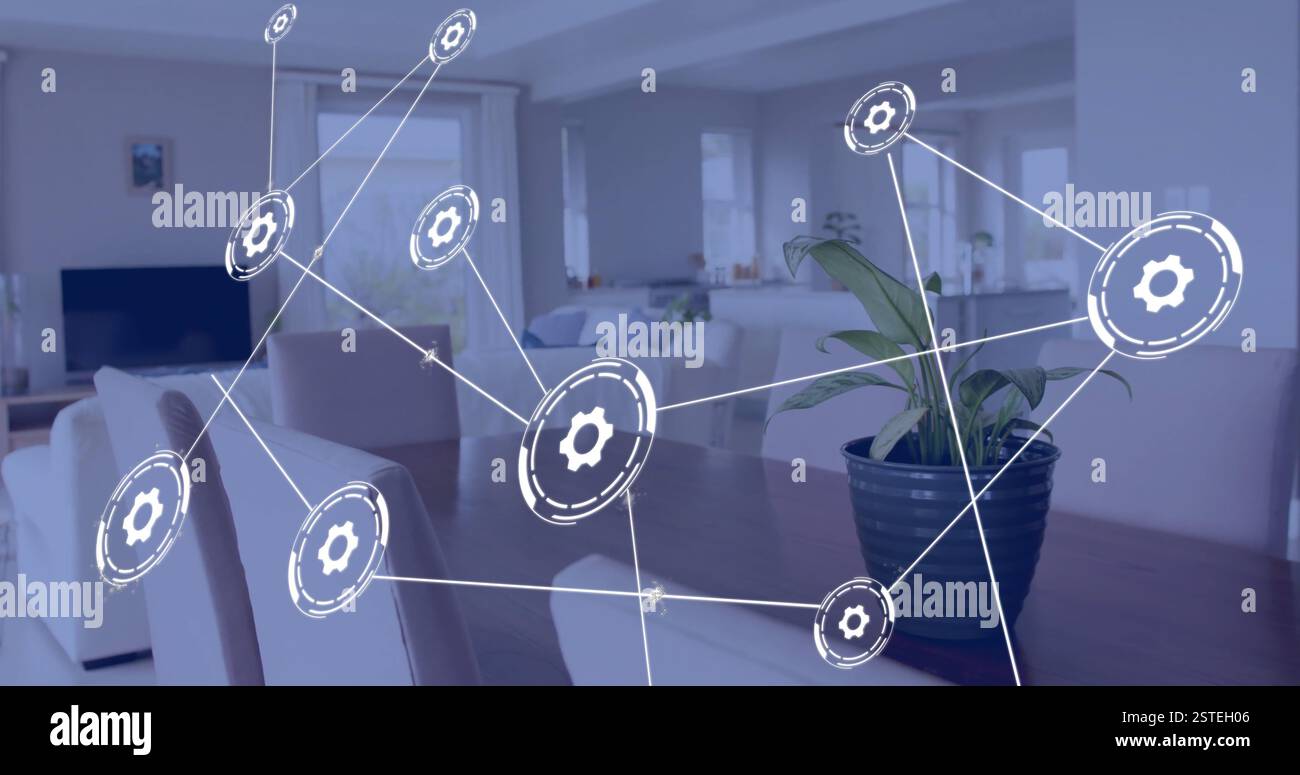 Gear icons connected by lines, network technology image over modern living room Stock Photo