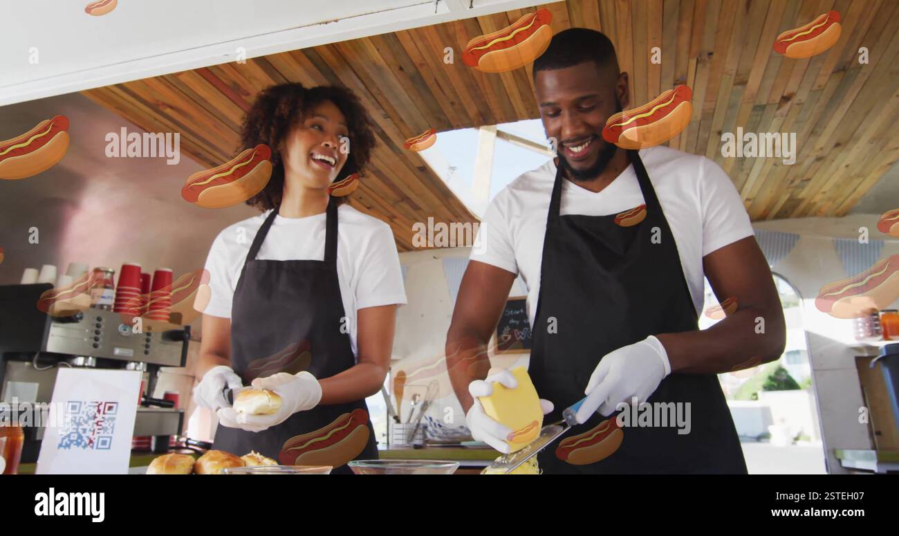 Preparing food, two chefs in kitchen with hot dog image Stock Photo