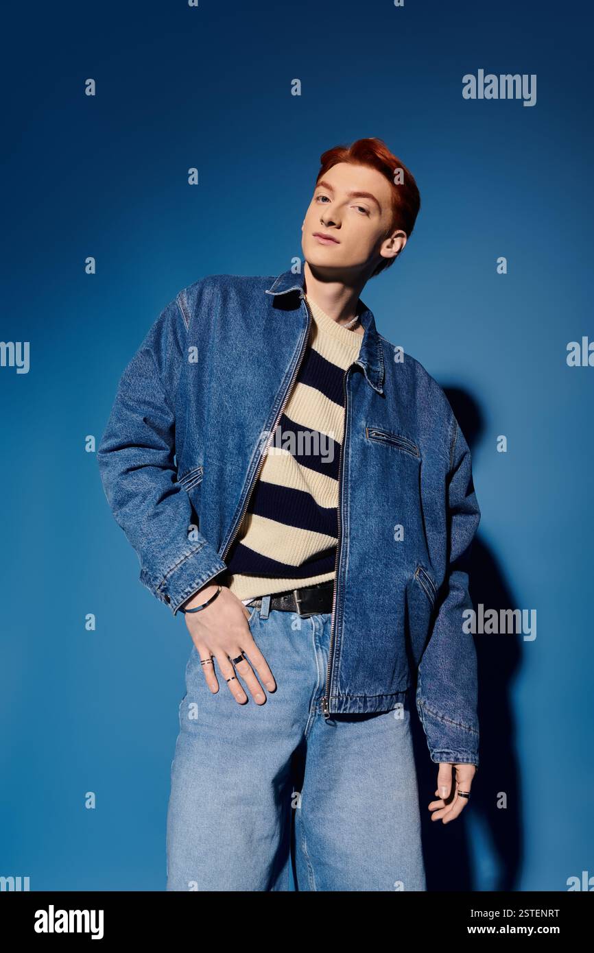 A young man poses confidently in a stylish outfit against a vibrant ...