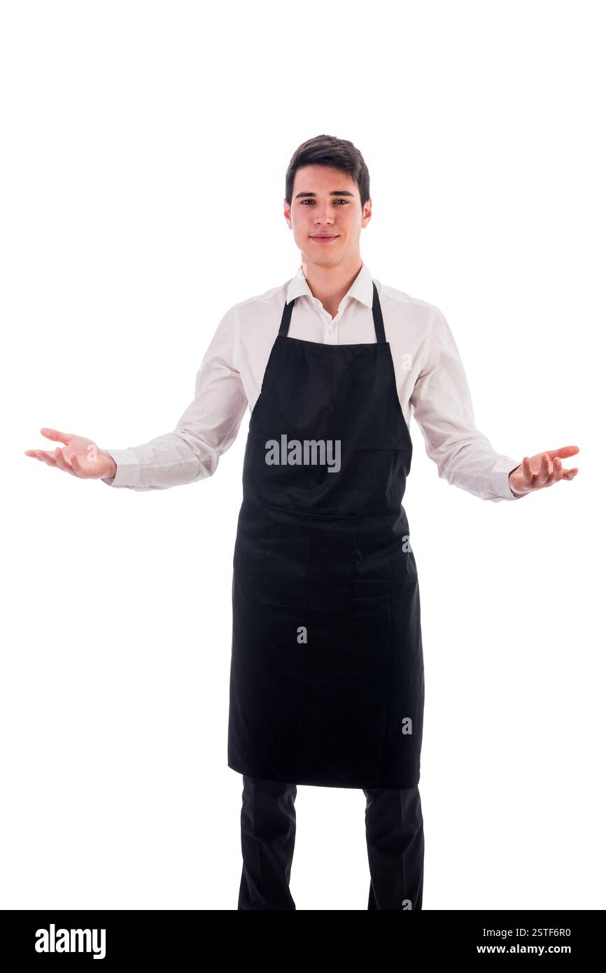 Young chef or waiter wearing black apron isolated Stock Photo - Alamy