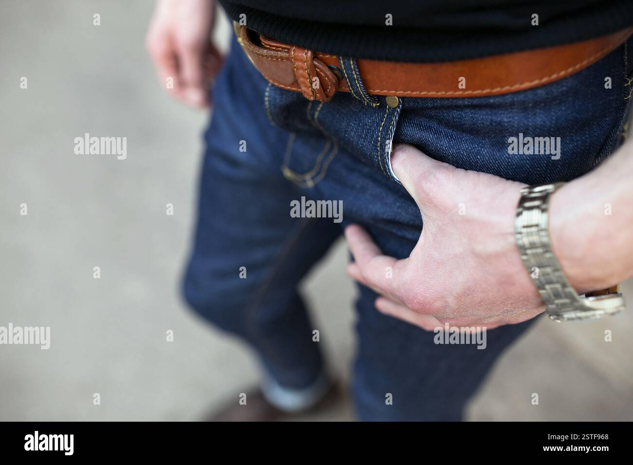 Confident man posing in selvedge  jeans Stock Photo