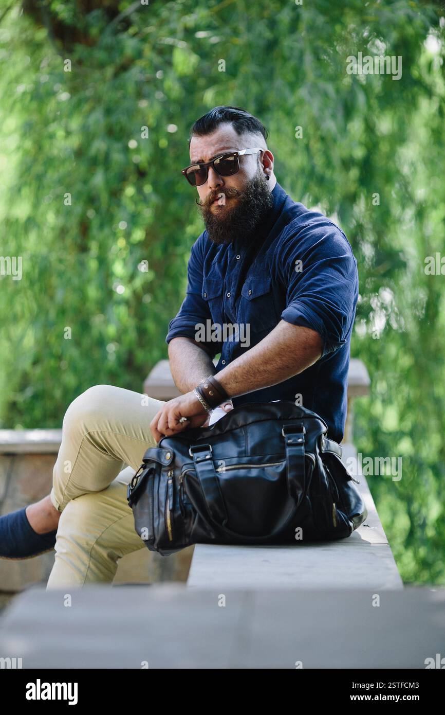 Bearded young man stands hi-res stock photography and images - Alamy