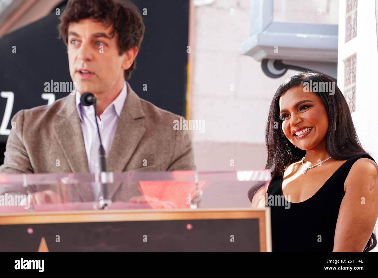 Mindy Struss B.J. Novak, left, speaks as Mindy Kaling looks on at a ceremony ...