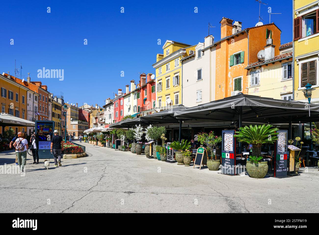 Rovinj, Croatia - September 25, 2024: Marshal Tito Square, Trg Marsala Tita, Rovinj, people at restaurant, cafe and bar Stock Photo
