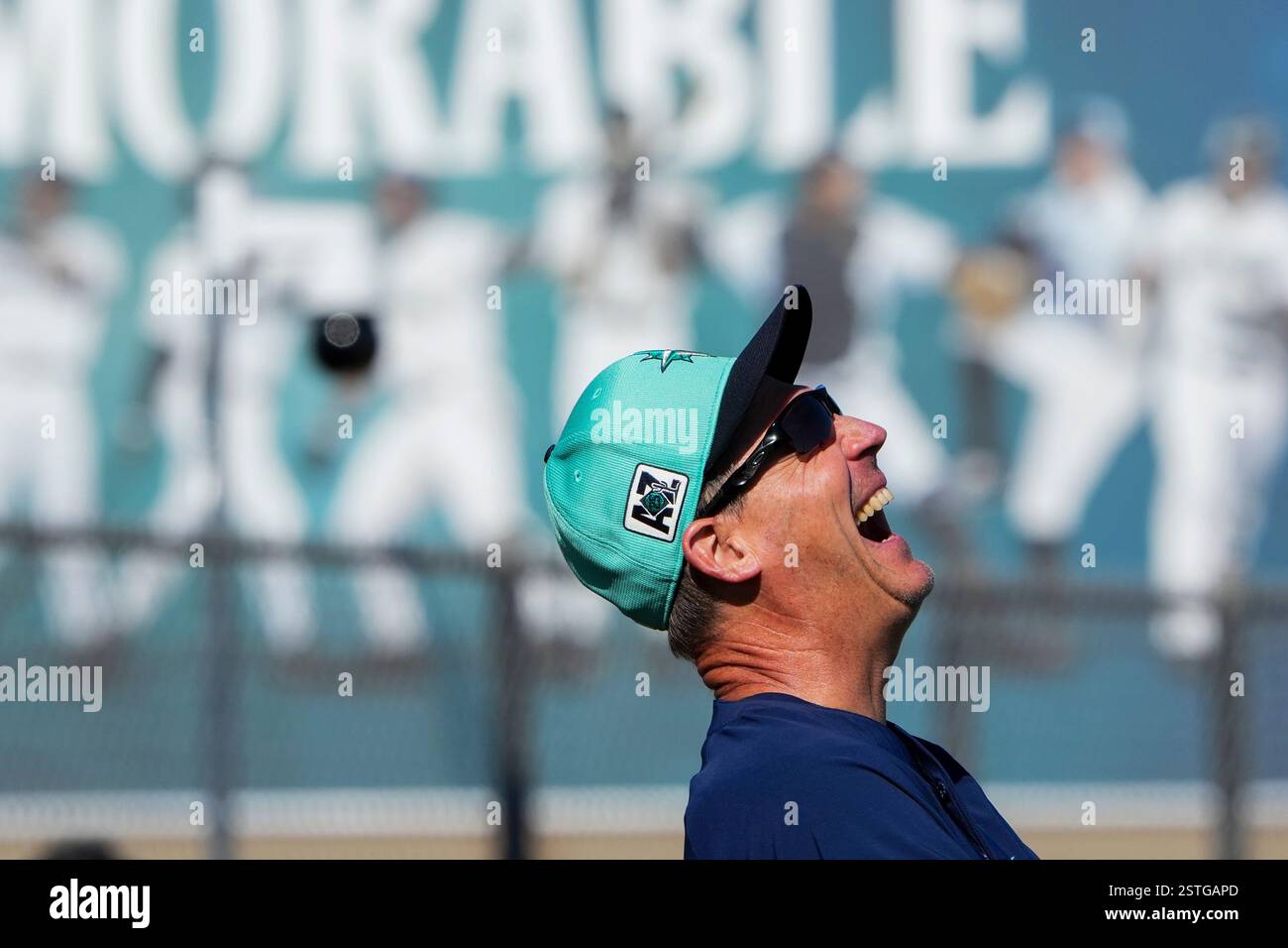Seattle Mariners manager Dan Wilson laughs during spring training baseball practice at the team
