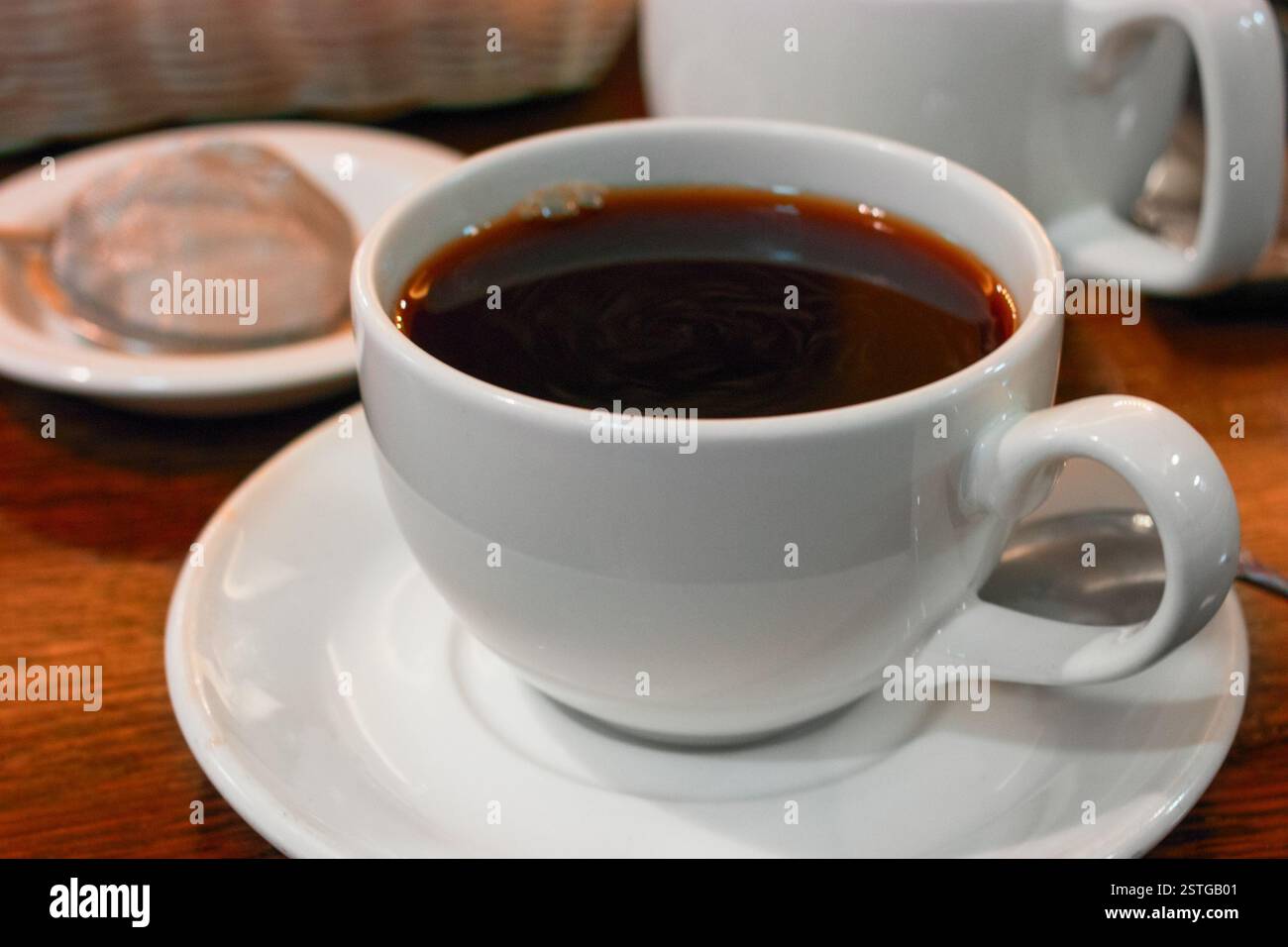 Closeup of cup of dark tea on table Stock Photo