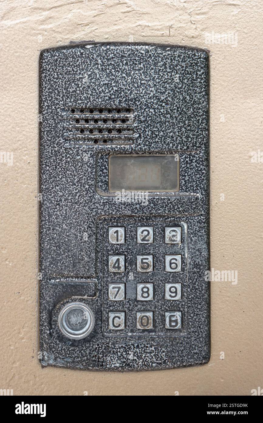Electronic access control door box with numeric keypad closeup. Security intercom number keypad at apartment door. Stock Photo