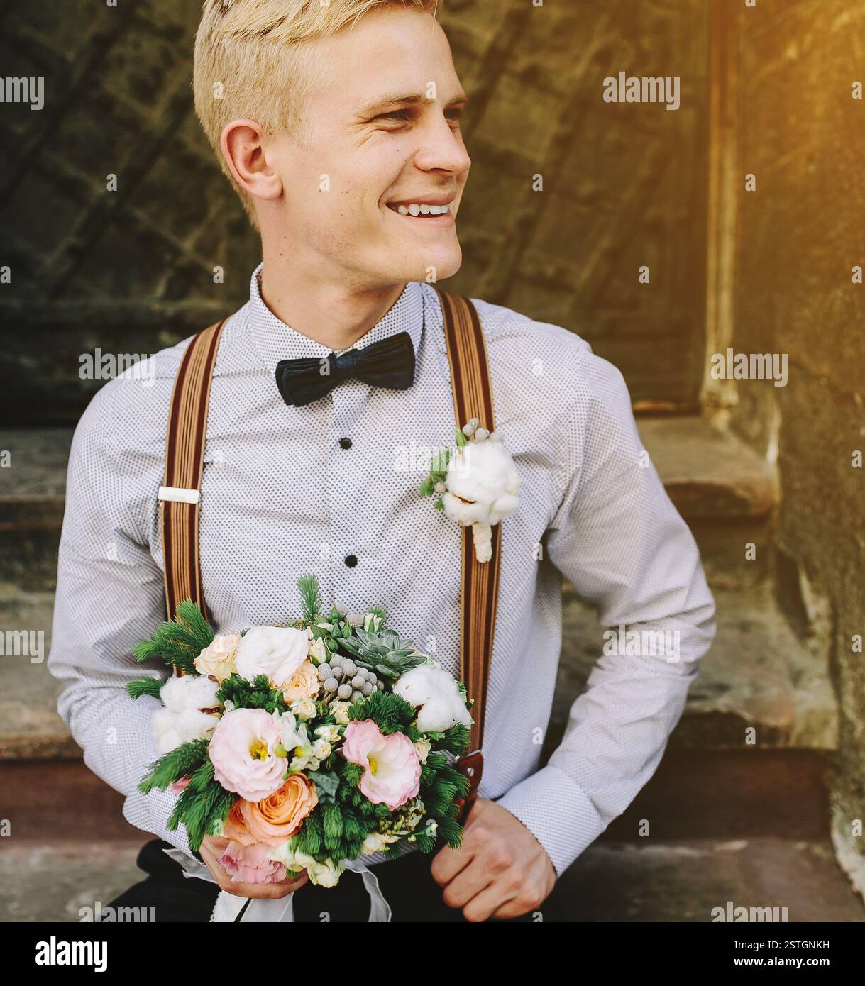 Bride sitting on steps bouquet hi-res stock photography and images - Alamy