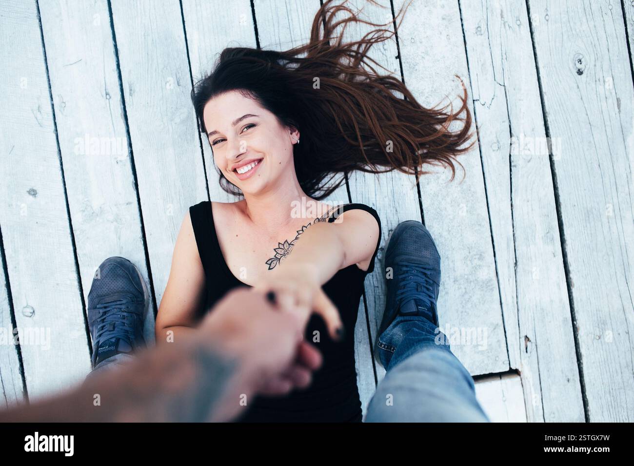 Brunette girl lying on floor hi-res stock photography and images - Alamy