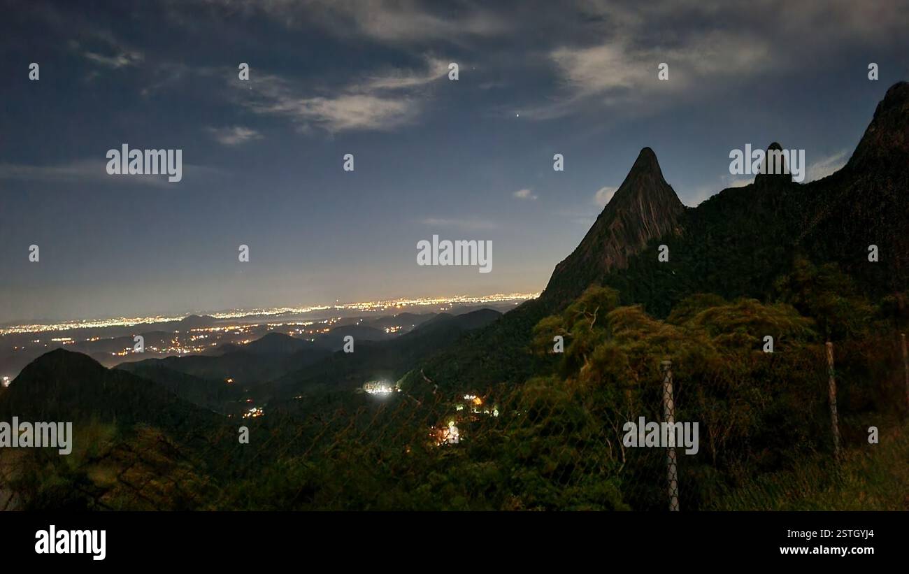 The night sky stretches infinitely, a deep canvas adorned with soft, drifting clouds and a single radiant star twinkling like a cosmic beacon. - Smartphone Captured Stock Image