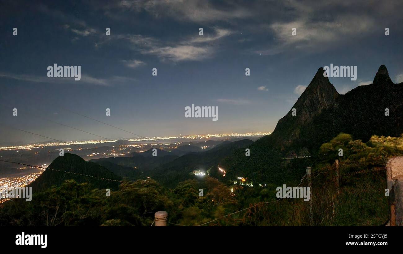 The night sky stretches infinitely, a deep canvas adorned with soft, drifting clouds and a single radiant star twinkling like a cosmic beacon. - Smartphone Captured Stock Image