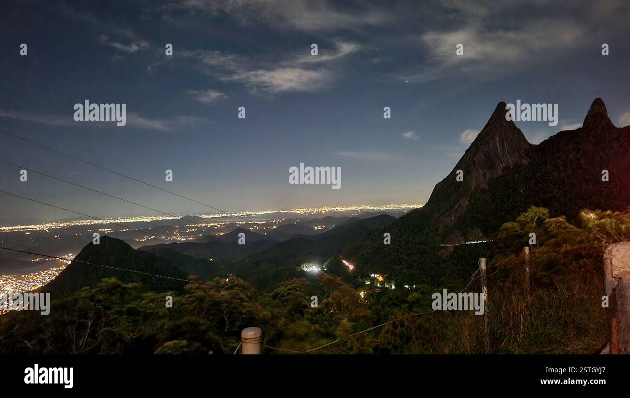 The night sky stretches infinitely, a deep canvas adorned with soft, drifting clouds and a single radiant star twinkling like a cosmic beacon. - Smartphone Captured Stock Image