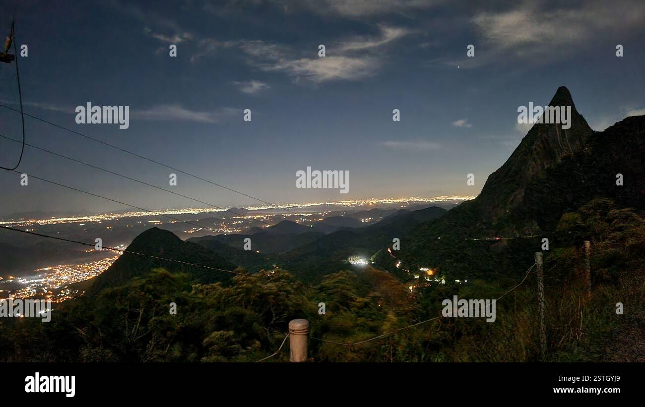 The night sky stretches infinitely, a deep canvas adorned with soft, drifting clouds and a single radiant star twinkling like a cosmic beacon. - Smartphone Captured Stock Image