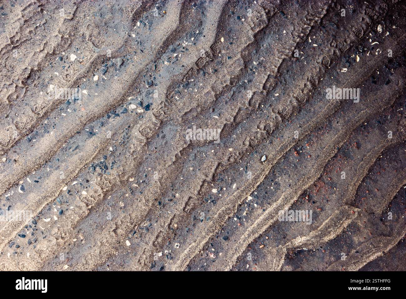 Waves pattern of sand on asphalt road after rain, dirty road texture ...