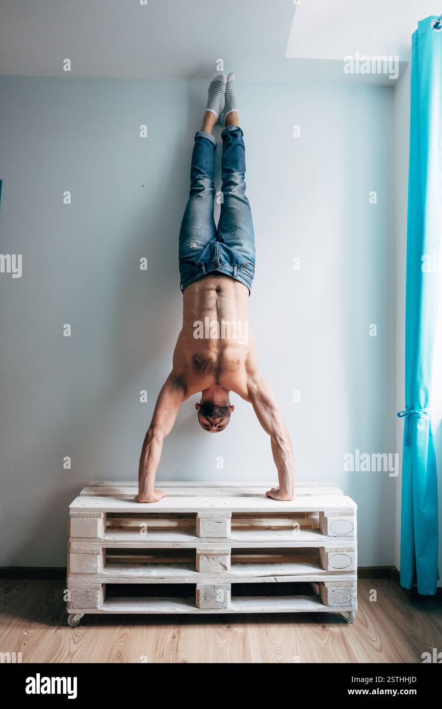 Standing upside down man hi-res stock photography and images - Alamy