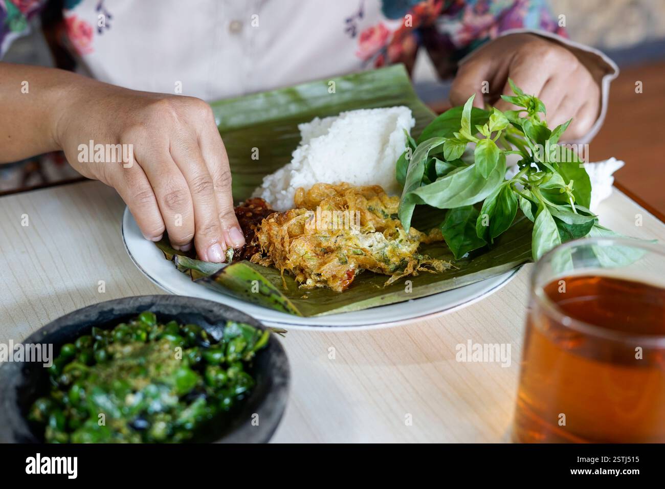 people eat rice complete with vegetables Stock Photo - Alamy
