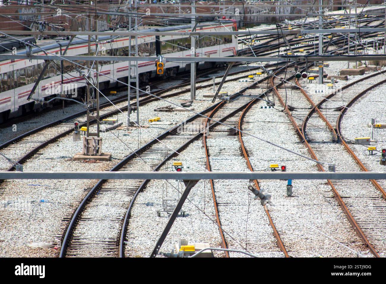 Railway tracks with a train and various equipment, showing railway ...