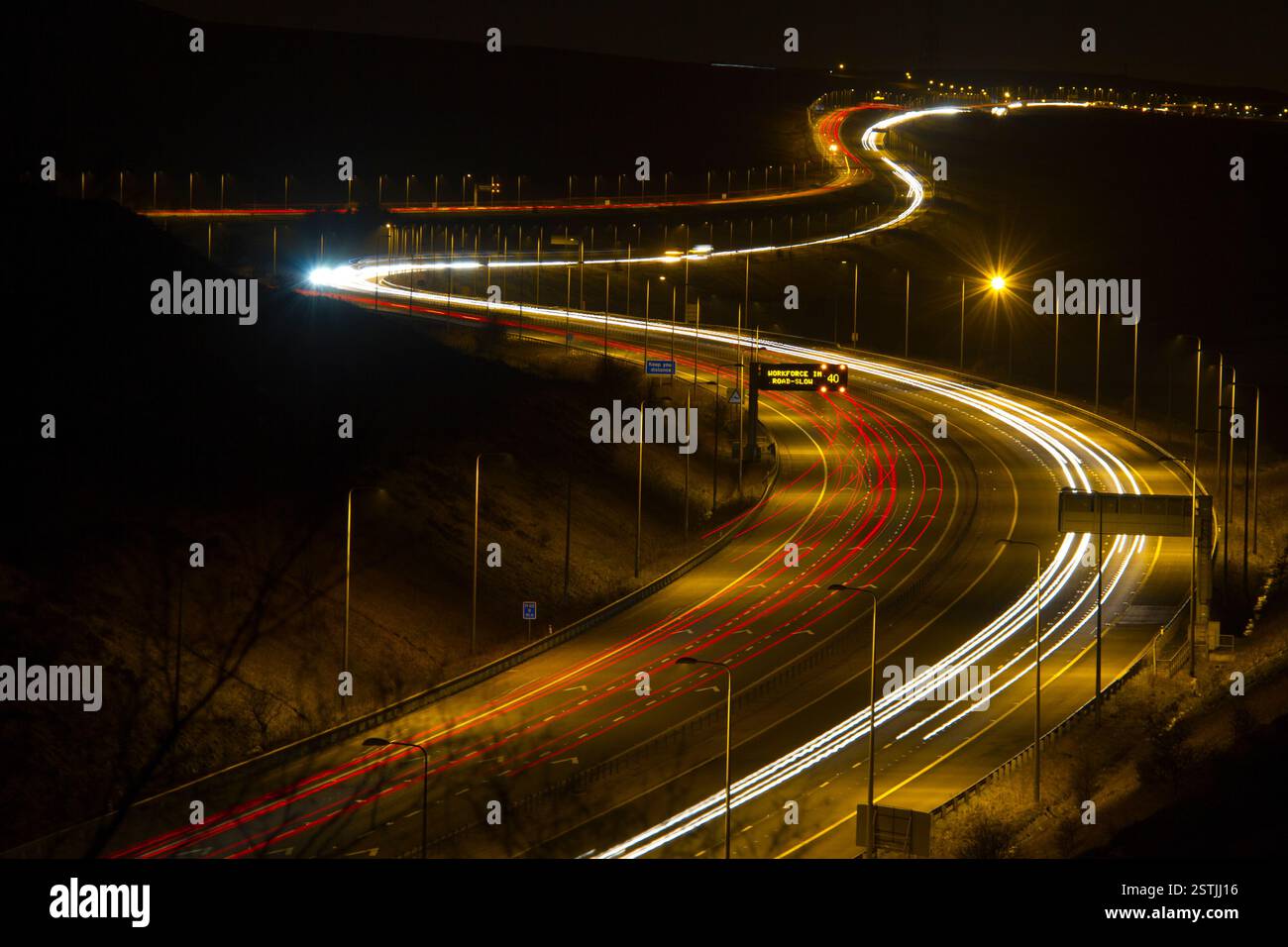 light trails on motorway highway at night Stock Photo - Alamy