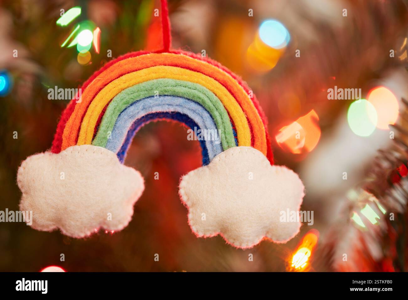 Hand made rainbow and clouds Christmas ornament Stock Photo