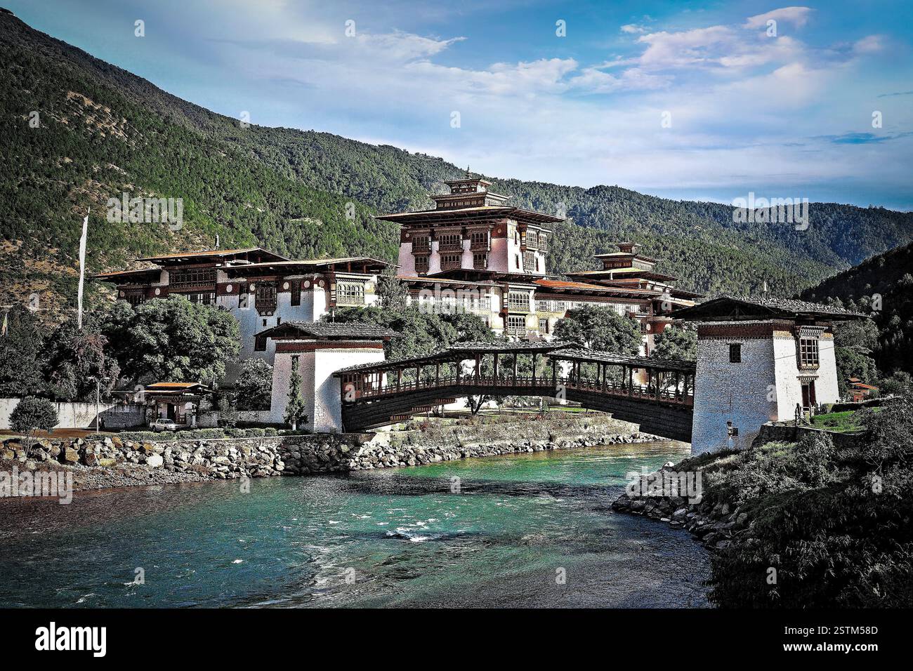 The majestic Punakha Dzong, a stunning fortress nestled at the confluence of the Mo Chhu and Pho Chhu rivers in Bhutan. Stock Photo