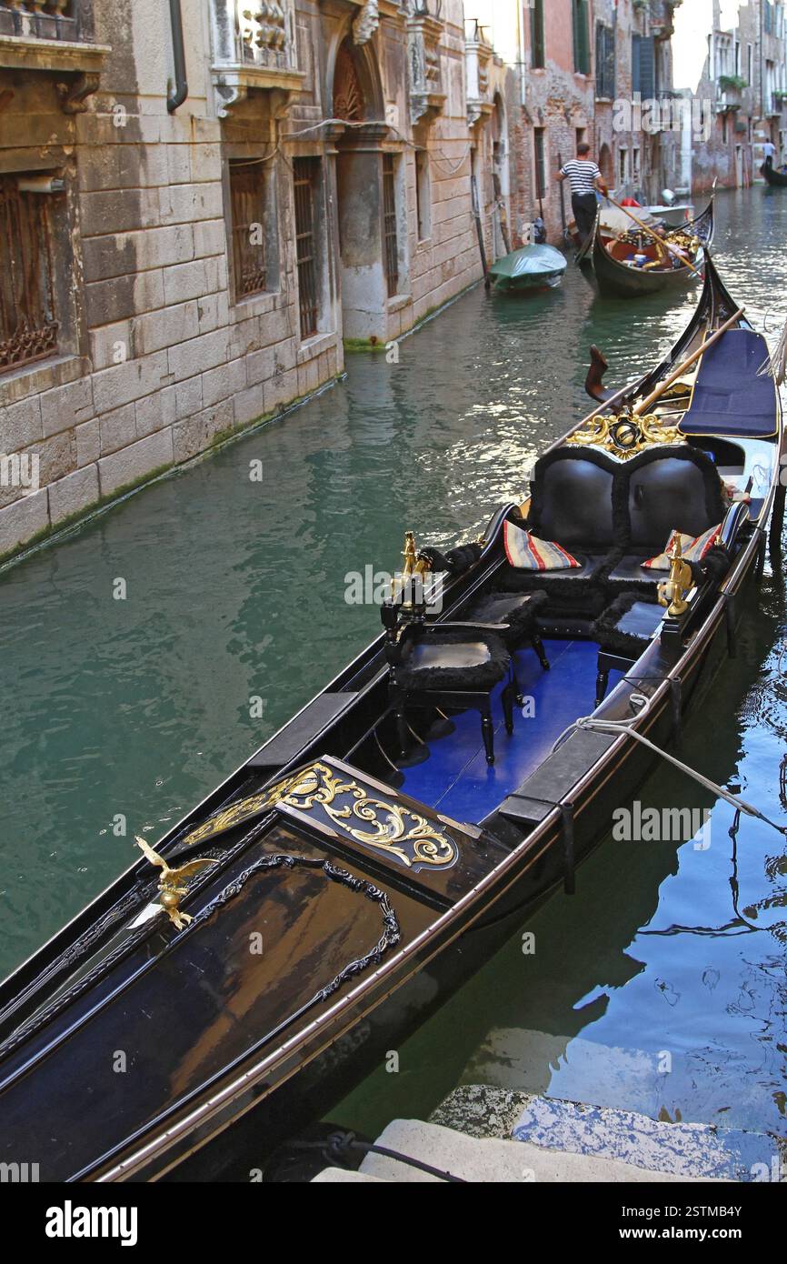 Gondola in narrow venetian canal hi-res stock photography and images ...