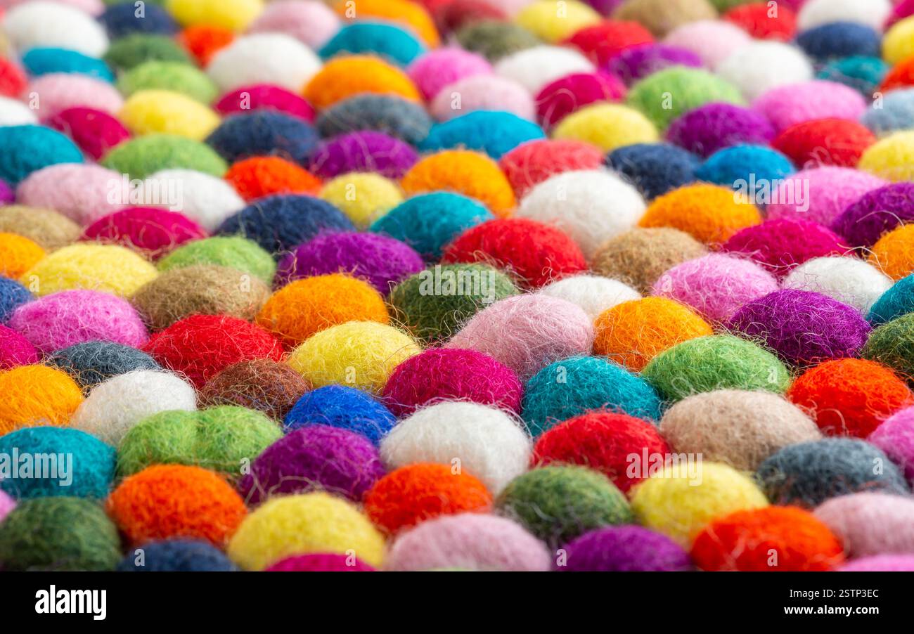 Multicolored felt ball rug detail Stock Photo