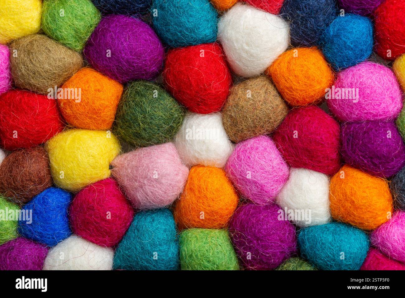 Multicolored felt ball rug detail Stock Photo