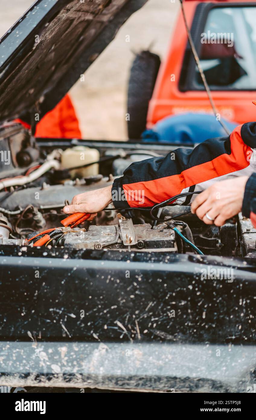Jump-Starting the Dead Battery using jumper electrical wires. Stock Photo