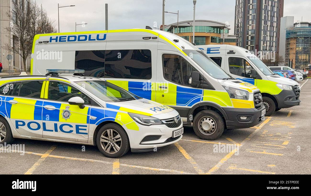 Cardiff, Wales, UK - 11 December 2024: Row of police vehicles used by the British Transport Police parked outside Cardiff Central railway station - Smartphone Captured Stock Image