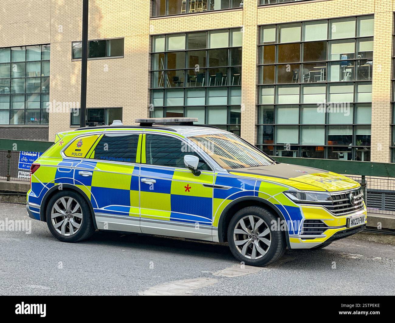 Manchester, England, UK - 31 May 2024: Police patrol car used by  the Greater Manchester police force parked in the city centre - Smartphone Captured Stock Image
