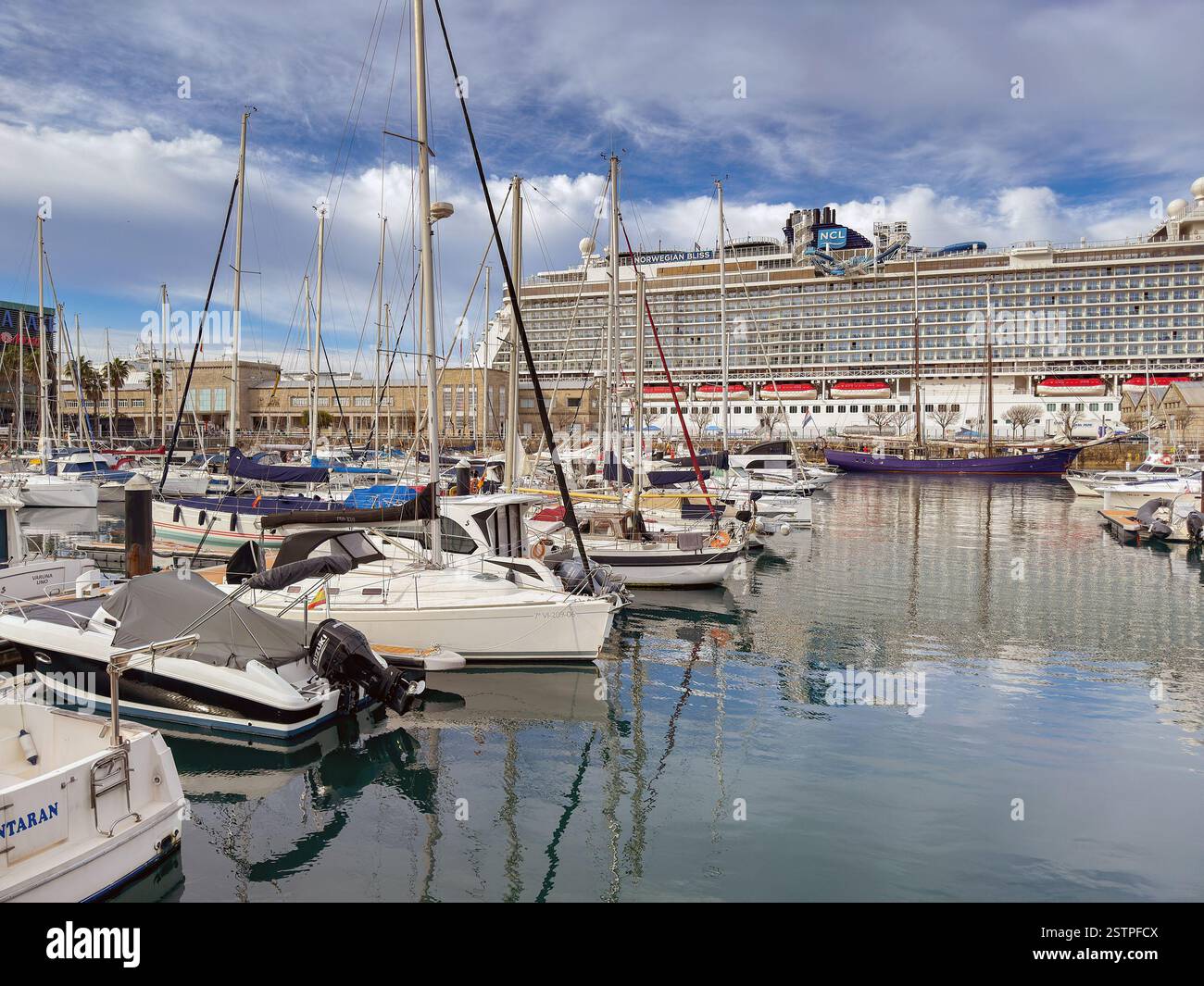 Vigo, Spain - 14 January 2025: Scenic view of the marina in Vigo with a visiting cruise ship, Norwegian Bliss, in the background - Smartphone Captured Stock Image