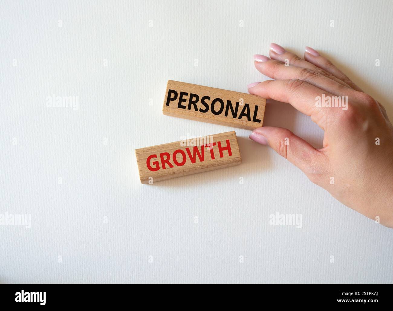Personal growth symbol. Wooden blocks with words Personal growth. Beautiful white background. Businessman hand. Business and Personal growth concept. Stock Photo
