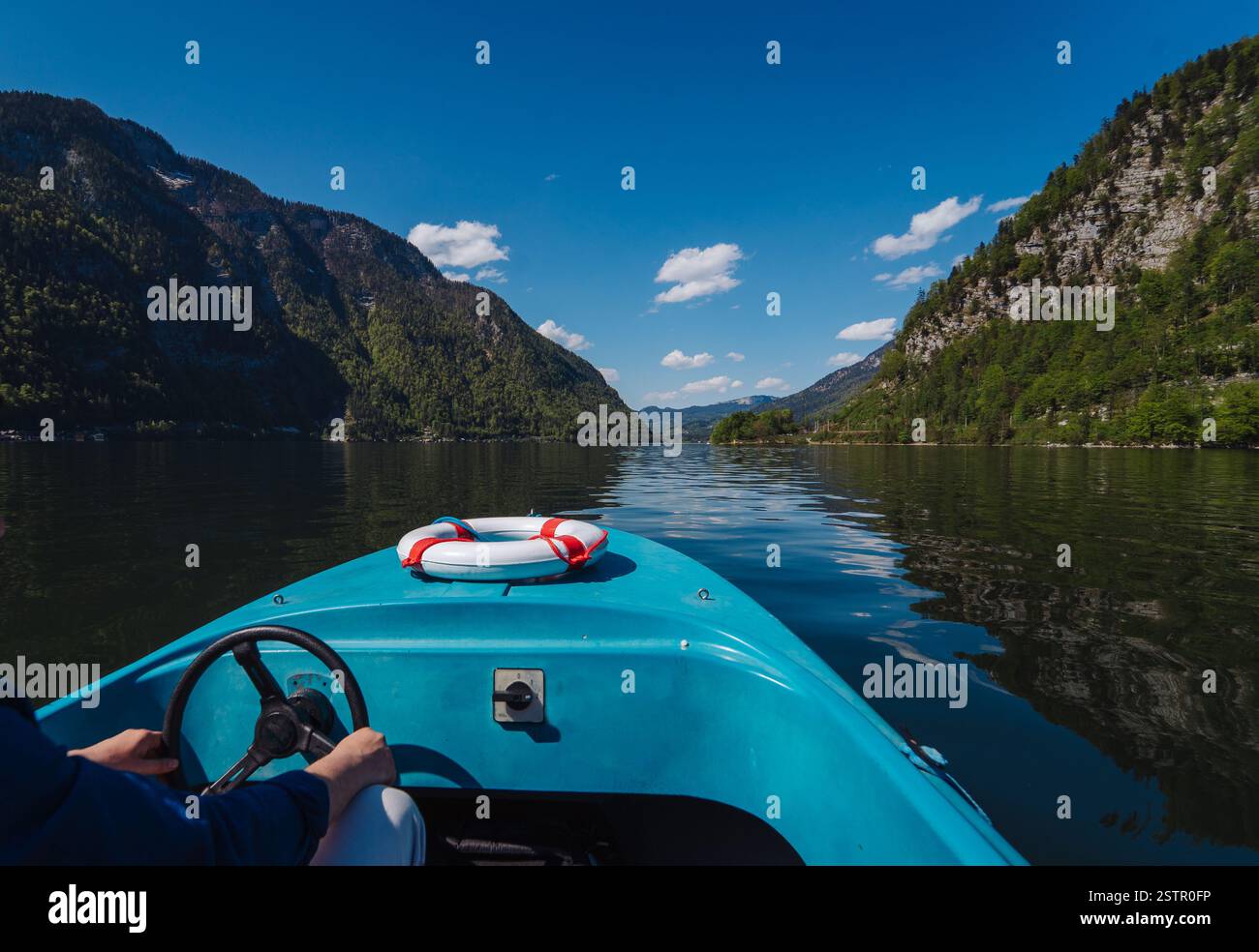 Young man steering boat hi-res stock photography and images - Alamy