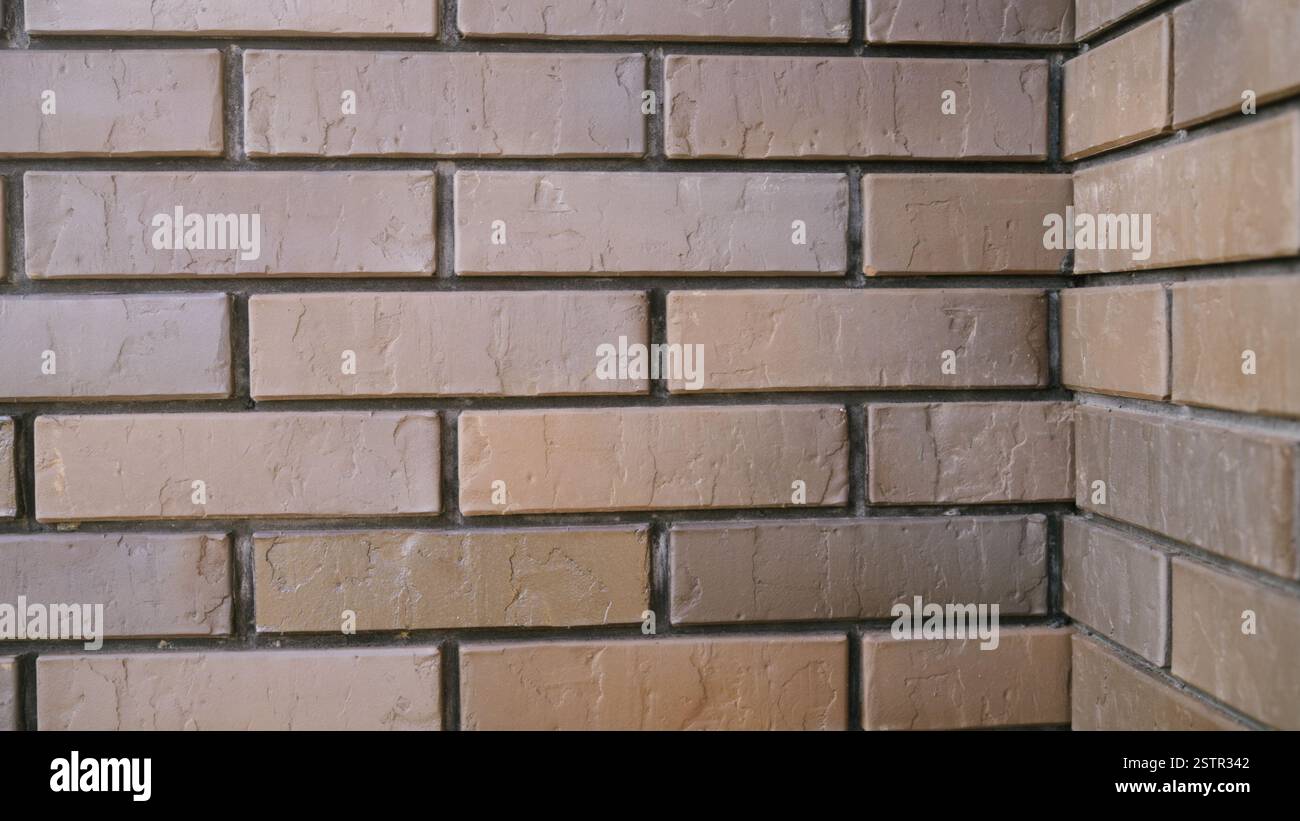 Camera movement captures a brick wall corner, showcasing architectural ...