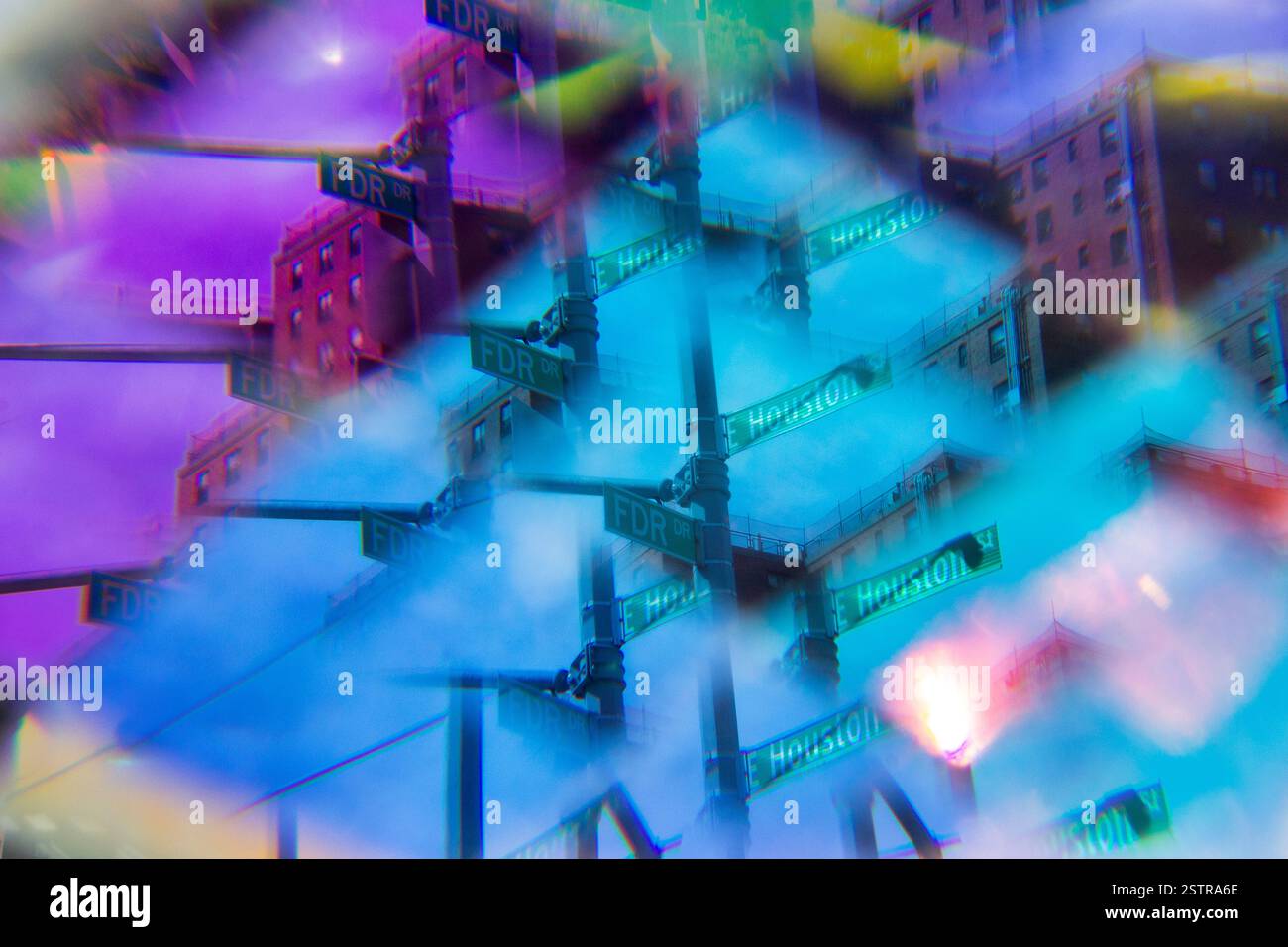Skyscrapers and bridges appear layered and fragmented through prism-refractions distorted and fractured Stock Photo