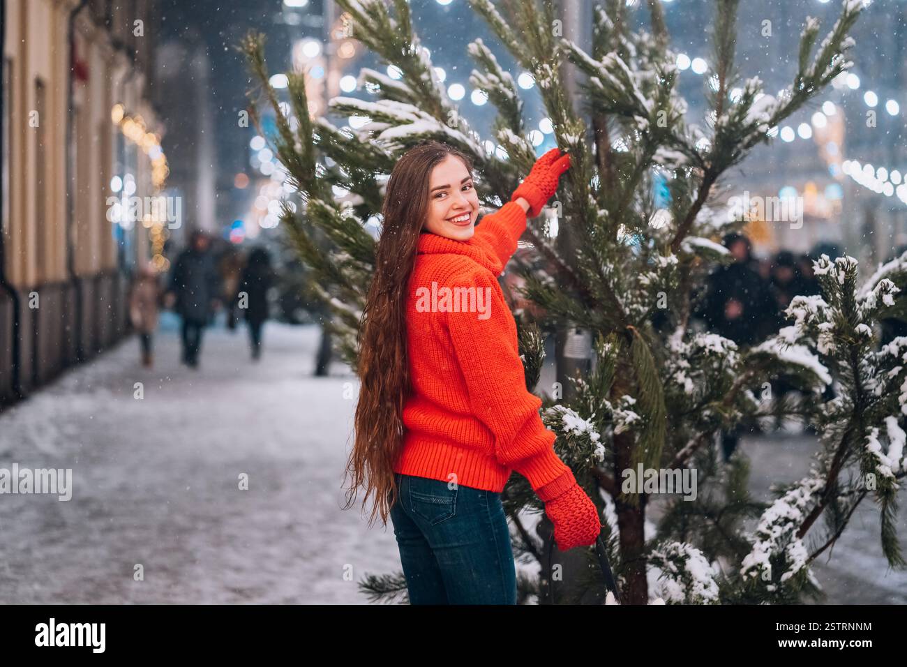 Young woman posing near tree hi-res stock photography and images - Alamy