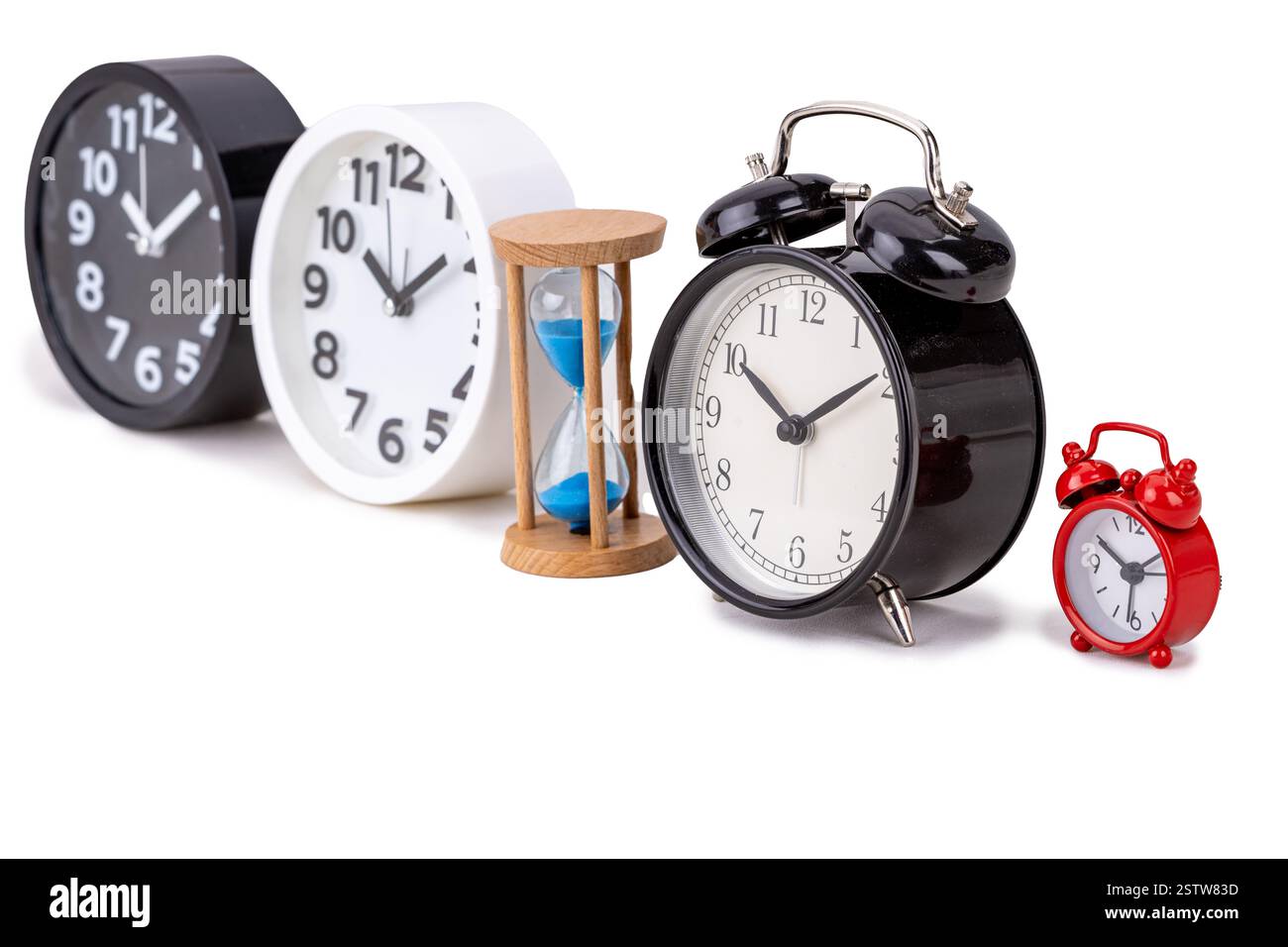 Vintage black alarm clock and modern clock on white background Stock Photo