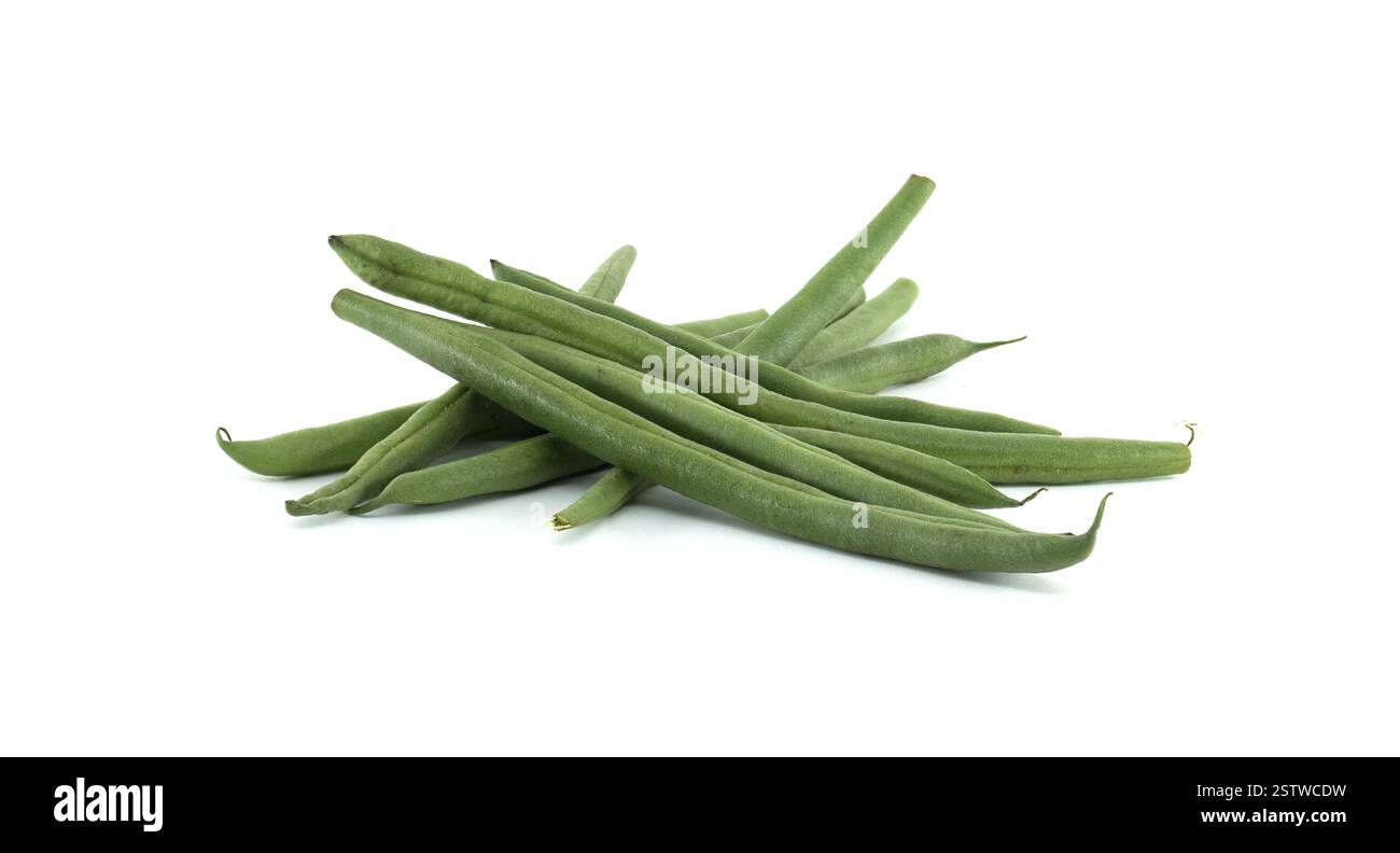 Green beans laying on a white background, creating a simple yet ...