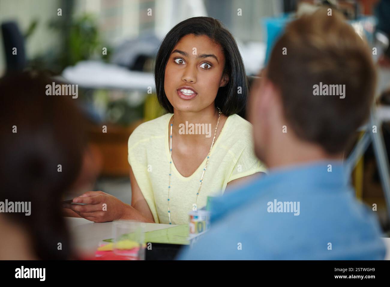 Creative, business woman and discussion in meeting for ideas ...
